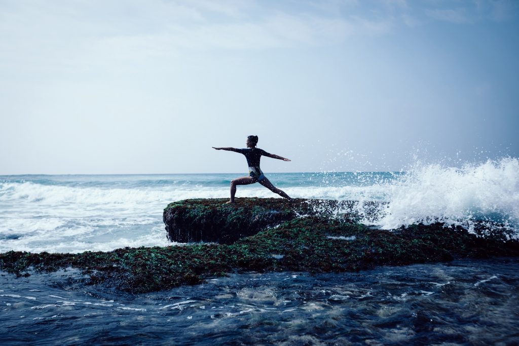 A woman enjoying yoga outdoors