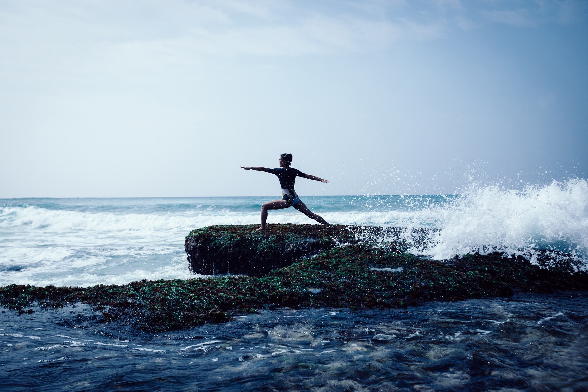 A woman enjoying yoga outdoors